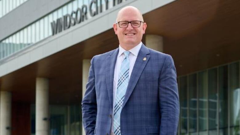 Drew Dilkens stands in front of Windsor city hall.