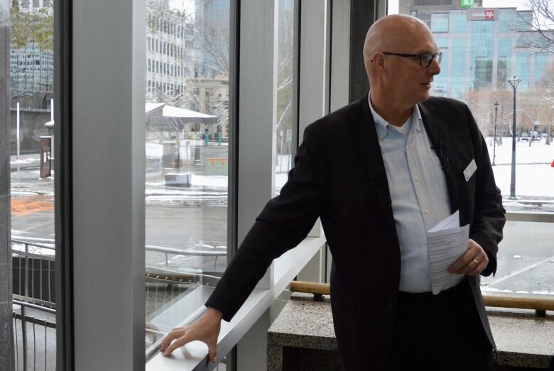 Regina Public Library executive Kevin Saunderson explains how some of the windows at the Regina Central Library were installed backwards in order to allow the installation of steel curtains on the building's exterior.  