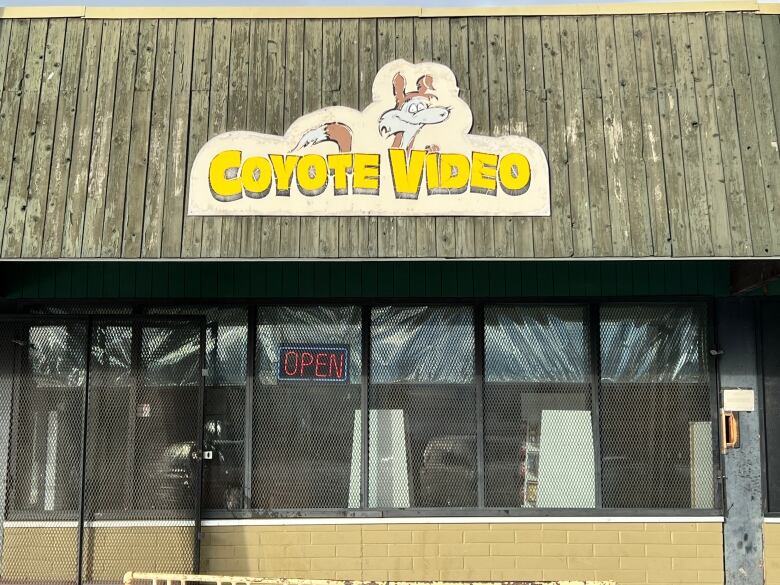 A sign above a storefront reads 'Coyote Video.'