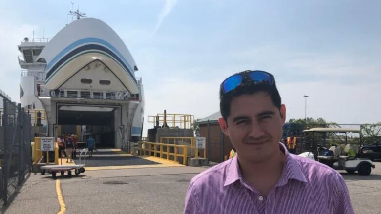 Daniel Torres Flores stands in front of the Pelee Islander II ferry in Kingsville on September 16.