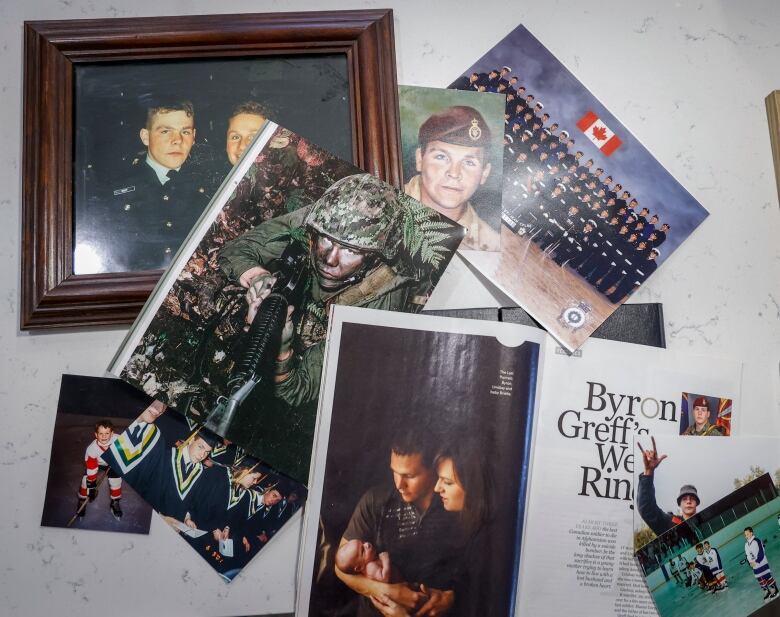 A collection of photos and magazines laid out on a table.