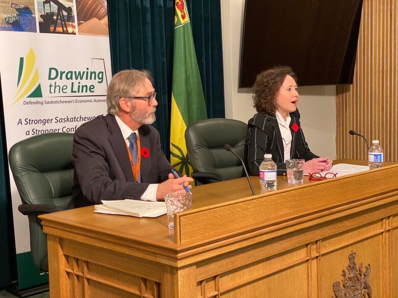 The director of the province's Constitutional Law Branch, Mitch McAdam (left), and Saskatchewan Justice Minister Bronwyn Eyre (right) take questions regarding the Saskatchewan First Act and its related amendments aimed to outline provincial jurisdiction over natural resources.