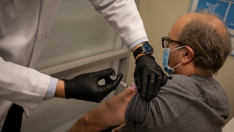 A Cape Breton man says getting a flu shot, like the man in this file photo from Toronto, should be available at no charge to seniors, even if they want the high-dose vaccine.