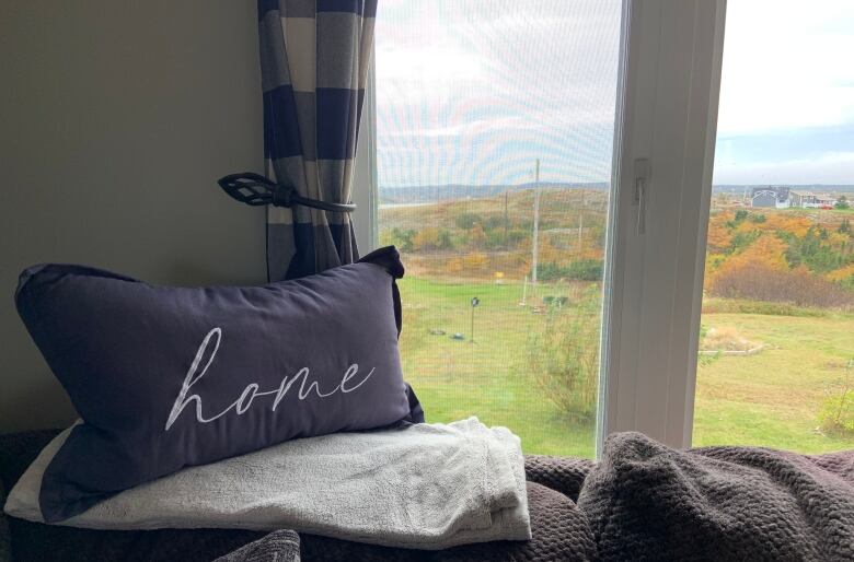 A pillow embroidered with the word 