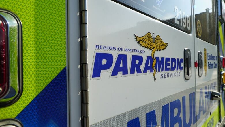 A close up of the back of an ambulance that reads: Region of Waterloo Paramedic Services.