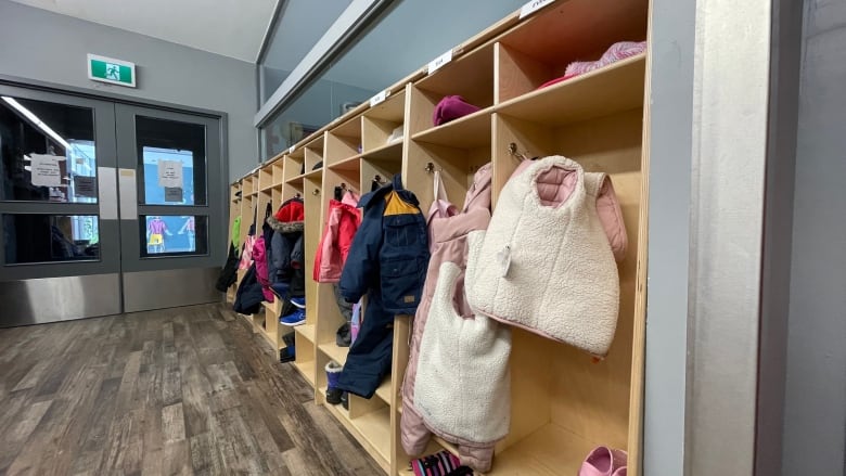 Cubbies with children's belongings are seen