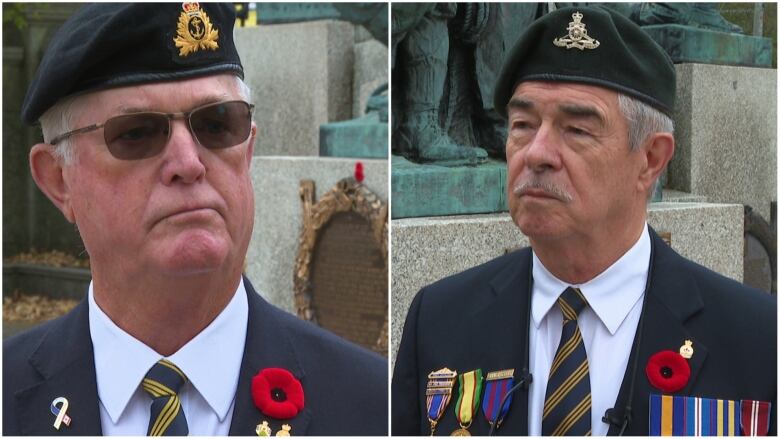 Two men in military uniforms stand behind a war memorial.