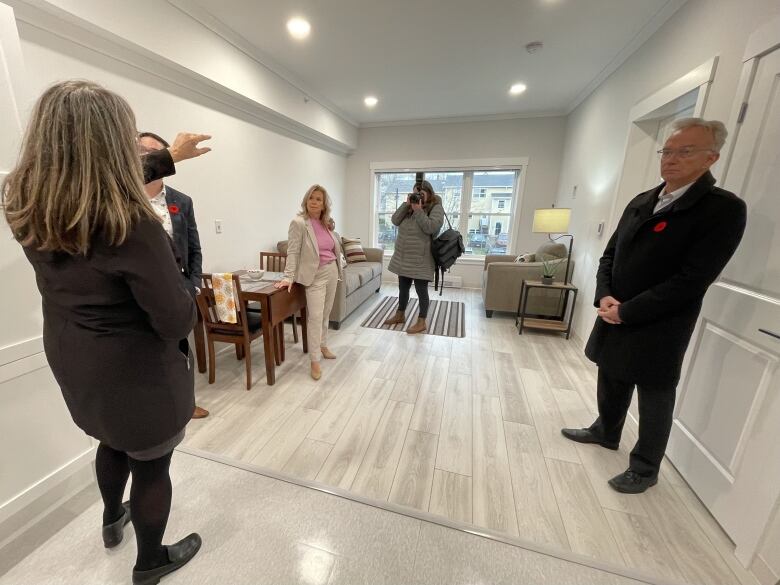 Officials in a small, 300-square-foot bachelor apartment.