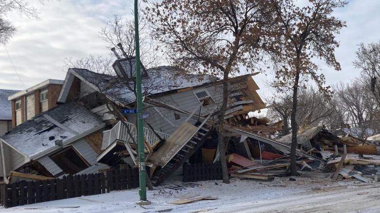 The debris of a home sits in a pile of rubble.