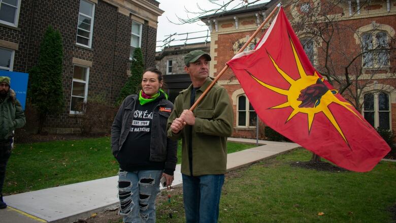 A man stands outside a courthouse.