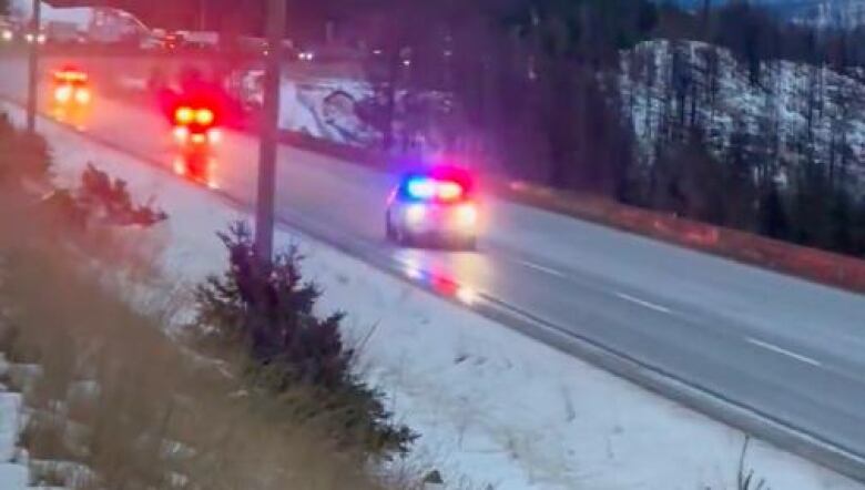 A still taken from video shot during a closure of the Coquihalla Highway on Nov. 23, 2022, shows a line of emergency vehicles rushing to deal with an undisclosed incident.