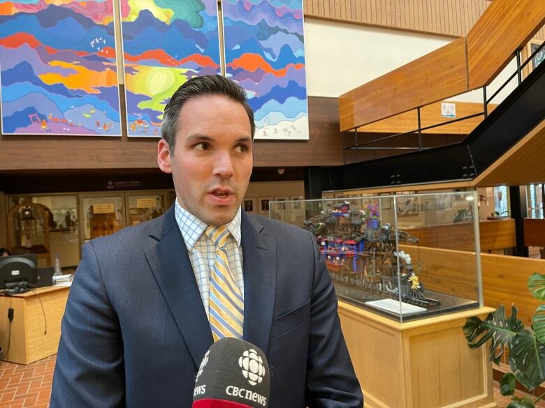 A man speaks into a microphone.