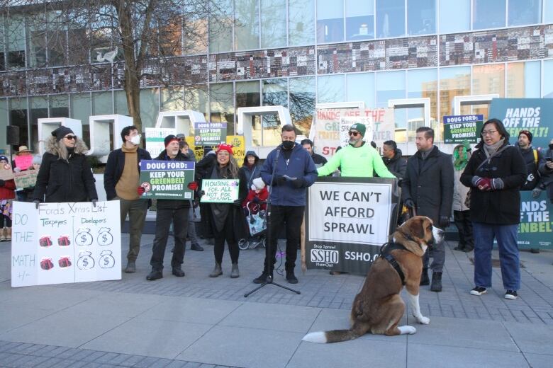 The eight councillors pictured are in order from left to right, Maureen Wilson, Alex Wilson, Mark Tadeson, Nrinder Nann, Cameron Kroetsch standing at the microphone, Craig Cassar, John-Paul Danko and Tammy Hwang. The dog belonged to John-Paul Danko.