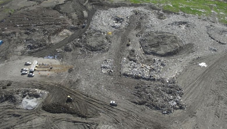 An aerial view of a landfill covered in dirt.