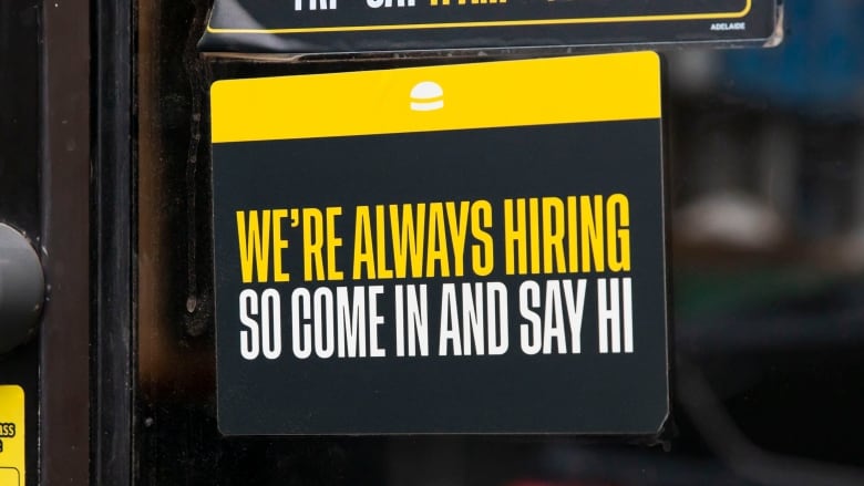 Sign in shop window reads in all capitals: 'We're always hiring so come in and say hi.