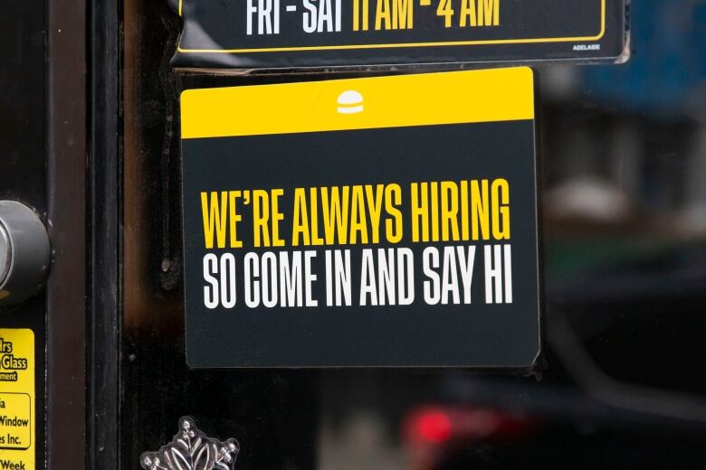 Sign in shop window reads in all capitals: 'We're always hiring so come in and say hi.