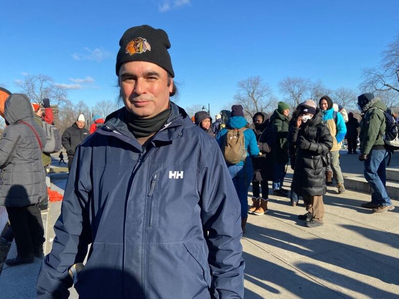 Ronald Brazeau wearing a navy windbreaker and black tuque at the protest