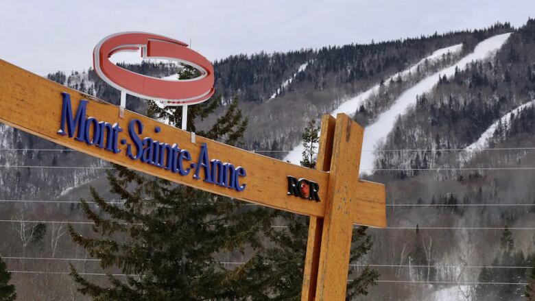 Photo of Mont-Sainte-Anne logo with ski hill in background