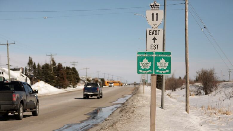 A road sign indicates the direction to go. 