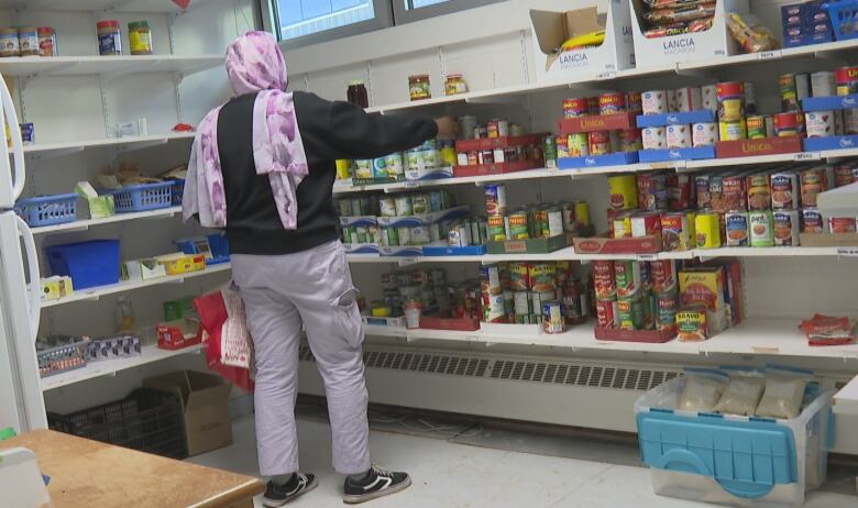 Woman getting food at a food bank 