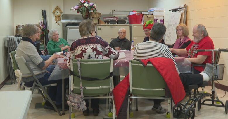 A group of people playing poker