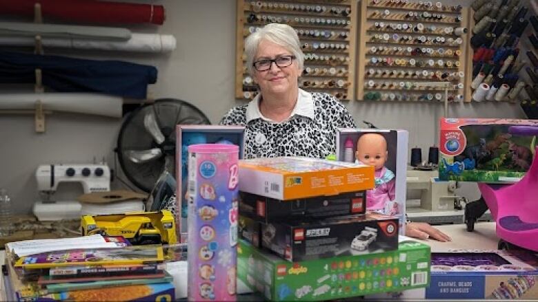 Christine Zareck of Angels of Prince Edward Island poses with some of the toys that they will be giving to Ukrainian children spending their first Christmas here on P.E.I.