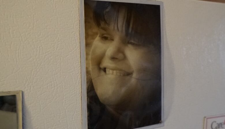 A photo of Hillary Taylor on the fridge.