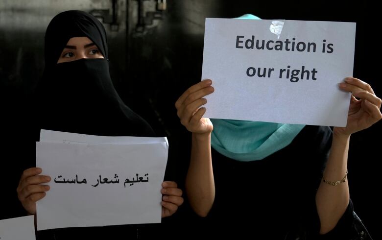 Afghan girls hold an illegal protest to demand the right to education in a private home in Kabul, Afghanistan on Aug. 2, 2022. For most teenage girls in Afghanistan, its been a year since they set foot in a classroom. With no sign the ruling Taliban will allow them back to school, some girls and parents are trying to find ways to keep education from stalling for a generation of young women.