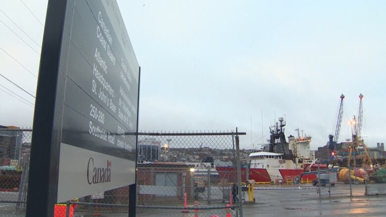 A red and white Coast Guard ship is docked in St. John's.