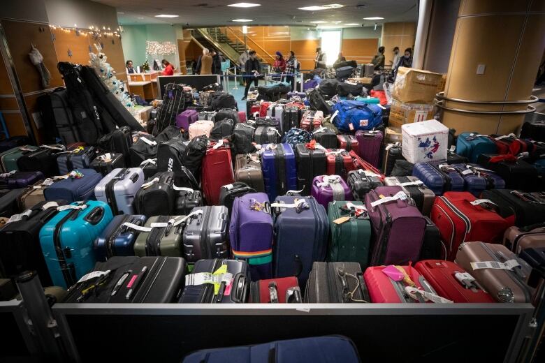 Luggage and bags are pictured at YVR International Airport after multiple delays due to weather in Richmond, British Columbia on Wednesday December 21, 2022.  