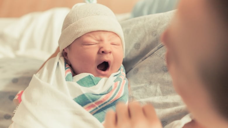 Mother holding newborn 