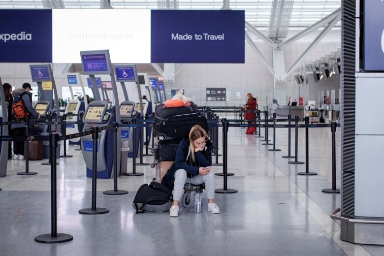 Travellers are pictured at Pearson International Airport, in Toronto, on Dec. 22, 2022  one of the busiest travel days of the holiday season.