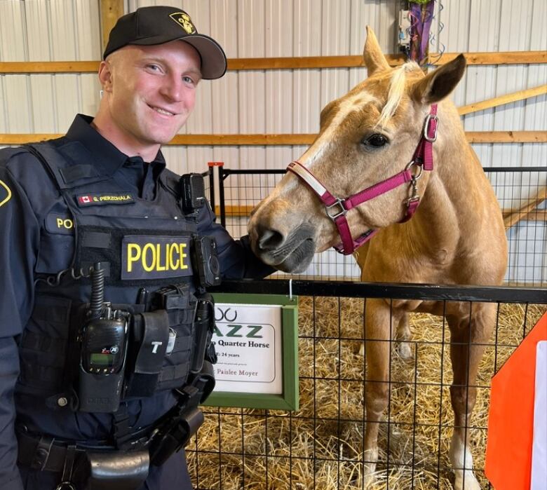 OPP Const. Grzegorz Pierzchal with a horse.