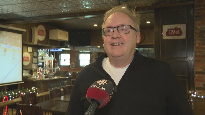 Kent MacPhee stands in pub in Charlottetown