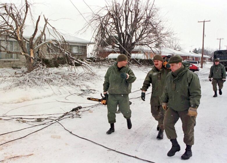 Soldiers cleanup after ice storm. 