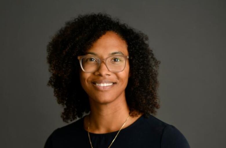 A head and shoulders photo of a woman 