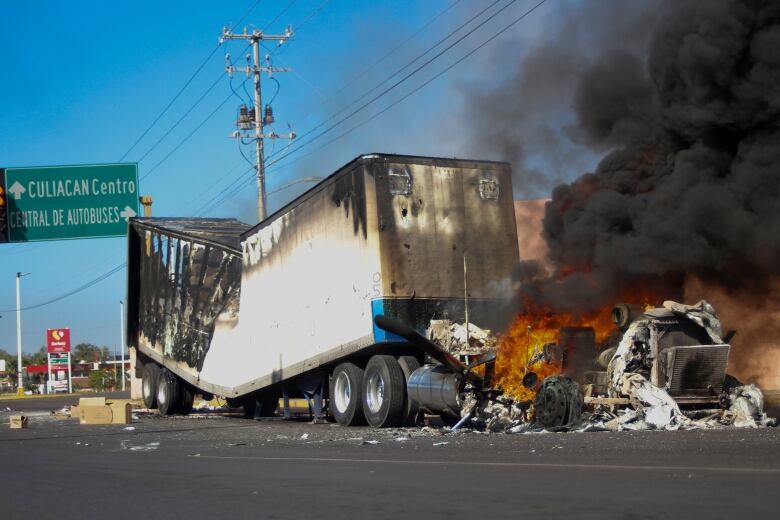 A truck burns on a street in Culiacan, Sinaloa state, Mexico.