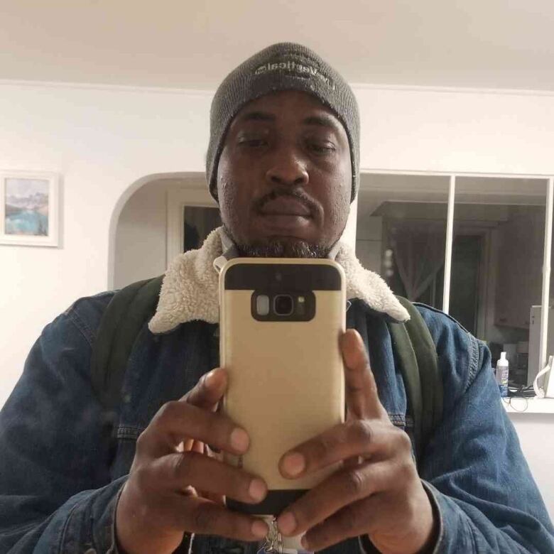 man taking a mirror selfie