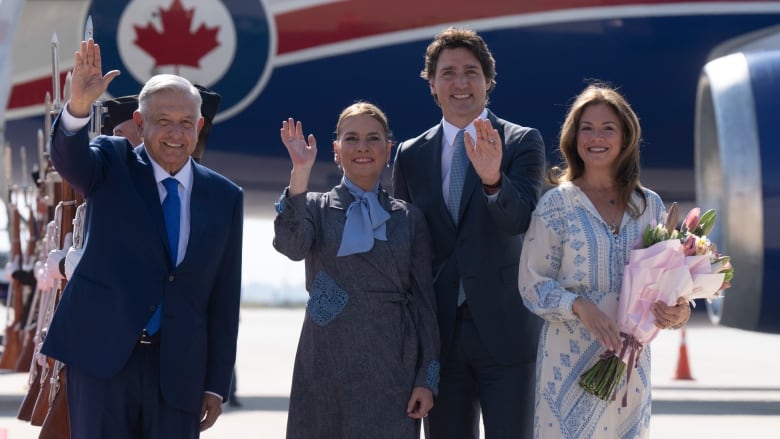 Prime Minister Justin Trudeau and Sophie Gregoire Trudeau wave with Mexican President Andres Manuel Lopez Obrador and Beatriz Gutierrez Muller.