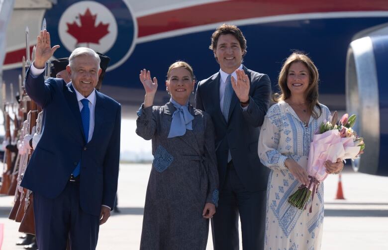 Prime Minister Justin Trudeau and Sophie Gregoire Trudeau wave with Mexican President Andres Manuel Lopez Obrador and Beatriz Gutierrez Muller.