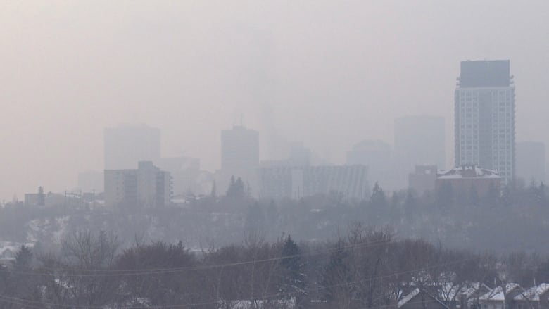 A foggy, far off view of buildings