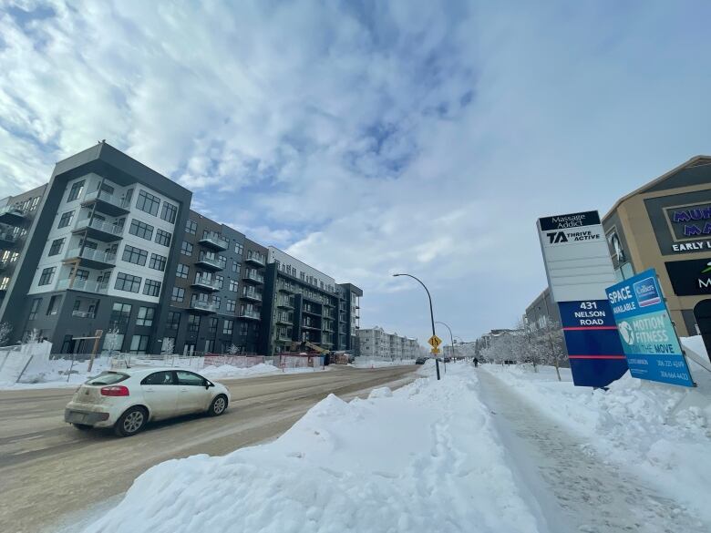 Snow piled on street.