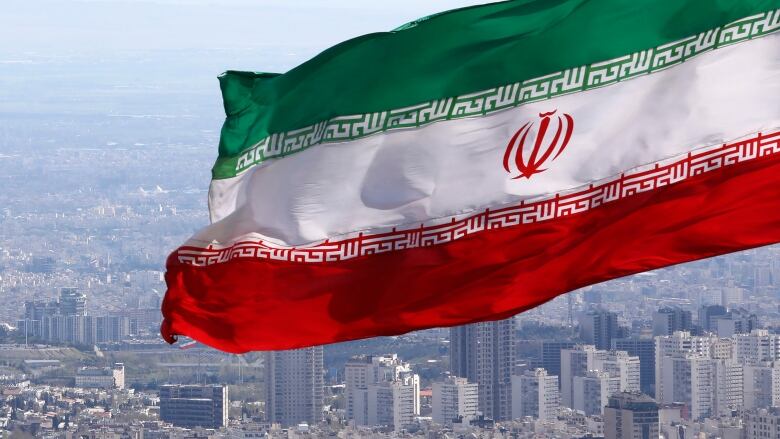 An Iranian flag is seen flying in Tehran, in a file photo taken on March 31, 2020.