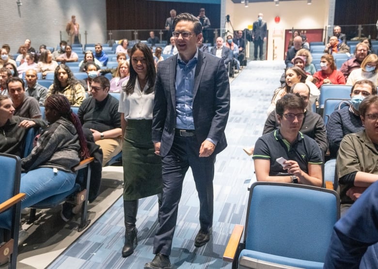 Federal Conservative Party Leader Pierre Poilievre and his wife, Anaida, arrive to speak at an adult education centre as he starts his tour of Quebec on Monday, January 16, 2023 in Montreal.