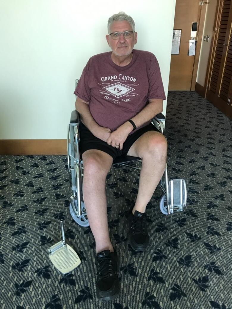 Jim Hamilton is shown sitting in the replacement chair in his hotel room in Chile.