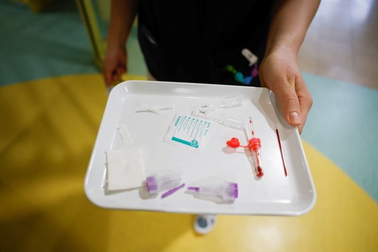 A tray with medical equipment used to treat a child with RSV in Germany.