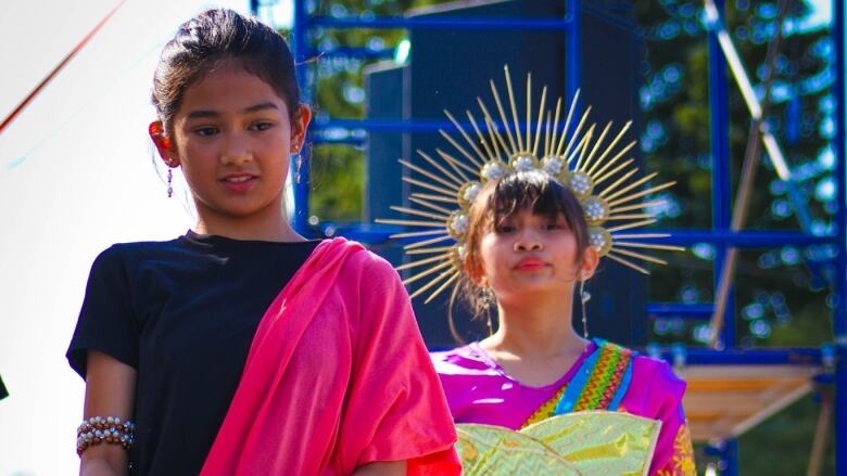 Nicole Rodriguez (left) and Maui Catacutan (right) celebrate their Filipino culture in traditional dress in Moosomin, Sask. in 2019. 