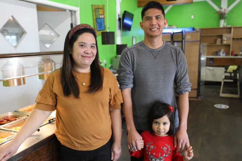 Local business owner Ria Lladones (left), and Leo Illustrisimo and his daugher Gracie are all members of the Moosomin Pinoy Community.