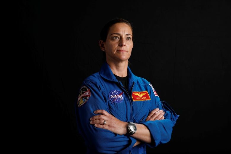 NASA astronaut Nicole Mann poses for a portrait photo in July 2019.