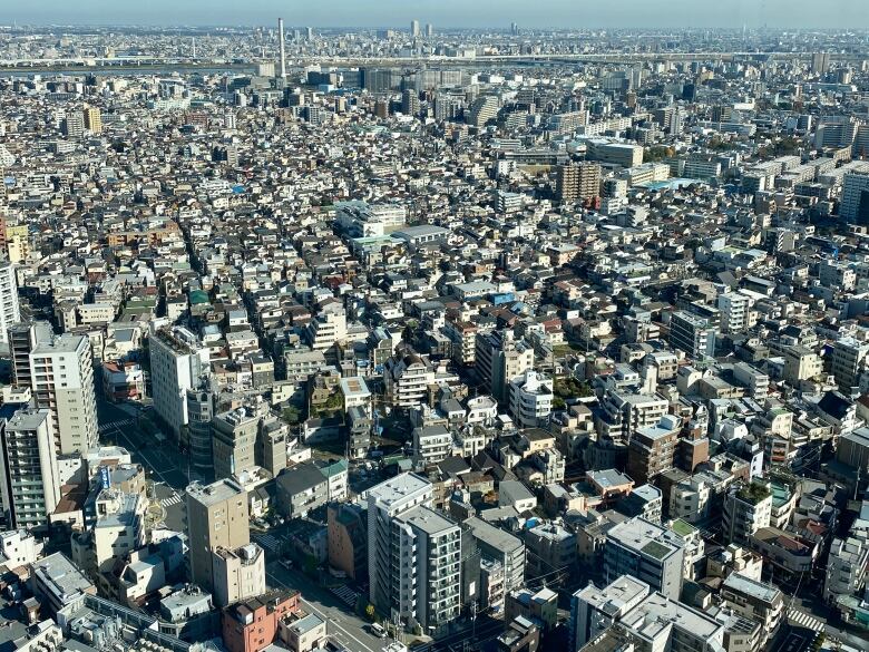 An aerial view of buildings fills the entire frame.